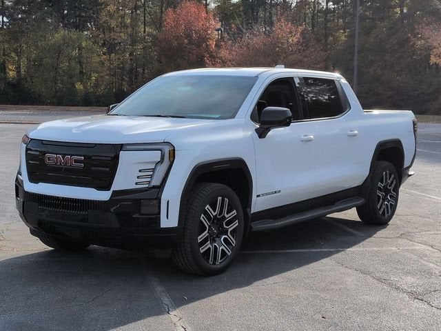 2026 GMC Sierra EV Elevation Standard Range in Summit White — front three-quarter view