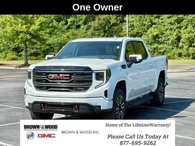 2025 GMC Sierra 1500 AT4 in Summit White — front three-quarter view